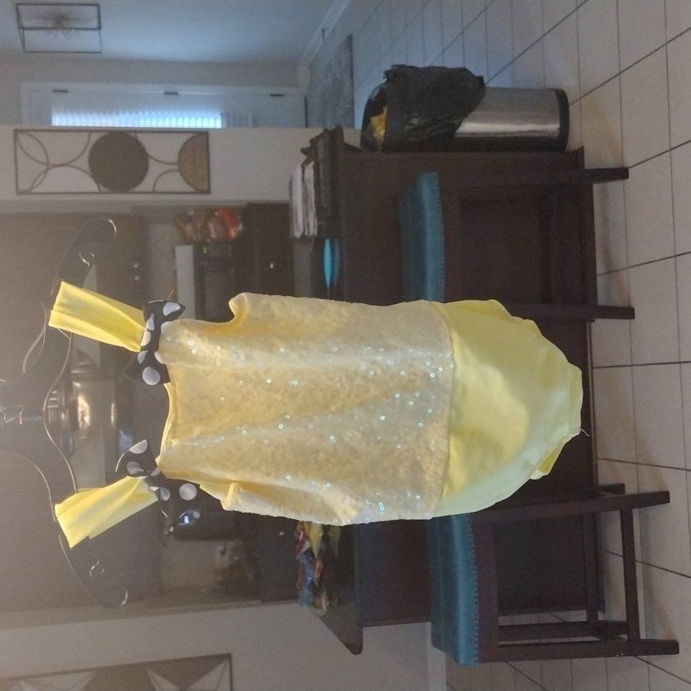 Bright yellow with polka dot bows and sequence swimming suit